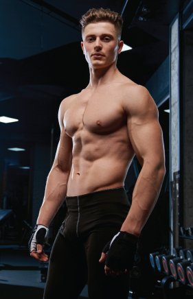 shirtless-sportsman-posing-gym